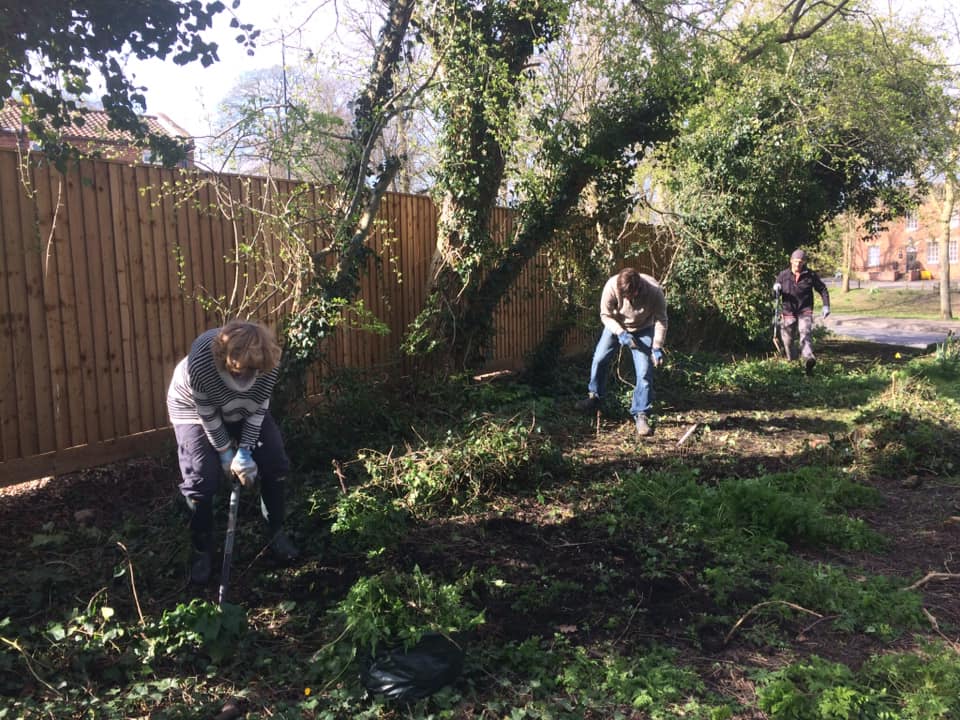 Volunteers preparing land for restoring hedge line